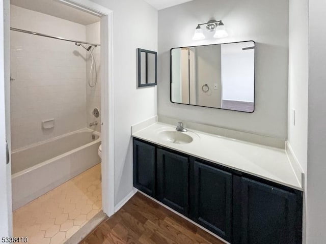 full bathroom featuring vanity, toilet, tub / shower combination, and wood-type flooring