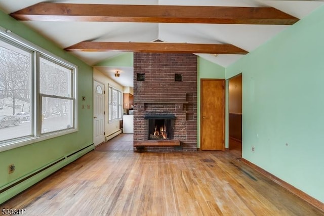 unfurnished living room featuring lofted ceiling with beams, a baseboard radiator, a brick fireplace, and light hardwood / wood-style flooring