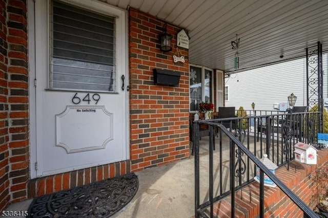 entrance to property with a porch