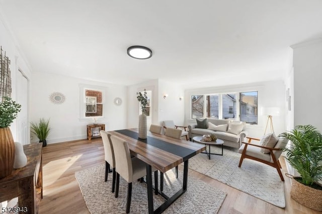 dining space with light hardwood / wood-style floors