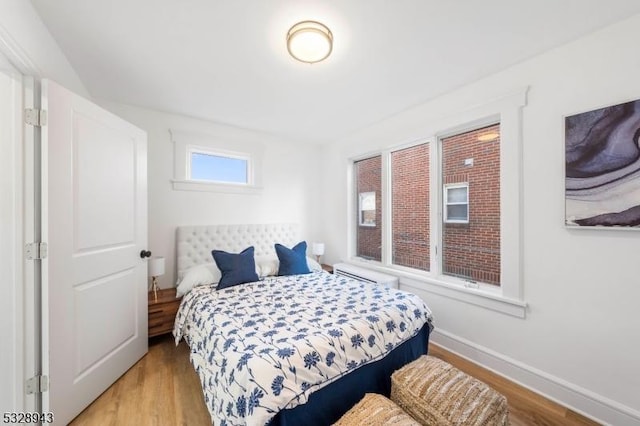 bedroom with light hardwood / wood-style floors