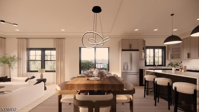 dining space featuring an inviting chandelier, crown molding, and wood-type flooring