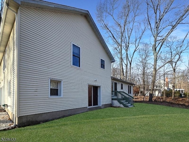 back of house featuring a yard