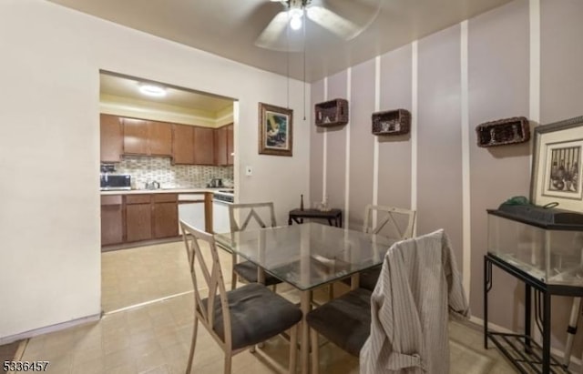 dining area with a ceiling fan