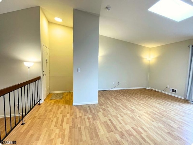 spare room featuring light hardwood / wood-style flooring