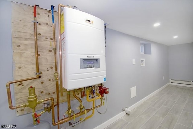 utility room with a baseboard heating unit and water heater