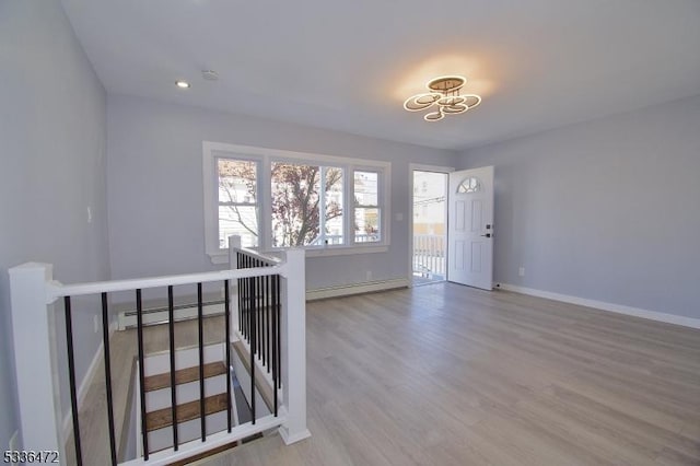 interior space featuring light hardwood / wood-style flooring and baseboard heating