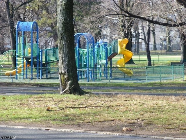 community jungle gym featuring fence