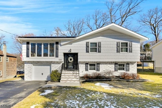 raised ranch featuring a garage