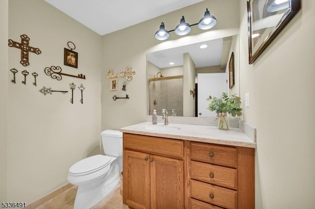 bathroom featuring vanity, tile patterned flooring, a shower with shower door, and toilet