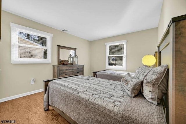 bedroom featuring hardwood / wood-style flooring