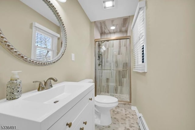 bathroom with vanity, a baseboard heating unit, an enclosed shower, and toilet