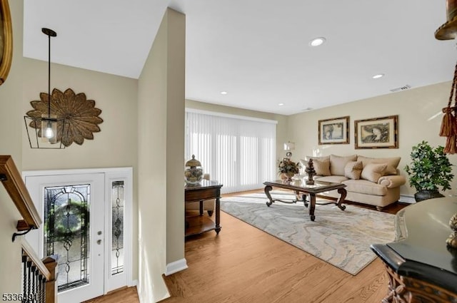 entryway with hardwood / wood-style flooring