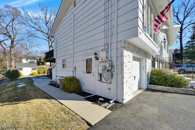 view of side of property with a garage