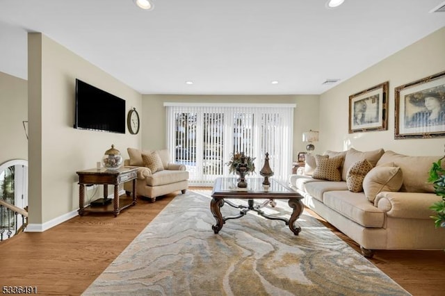 living room with light hardwood / wood-style flooring