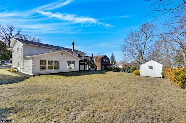 view of home's exterior featuring a shed and a yard