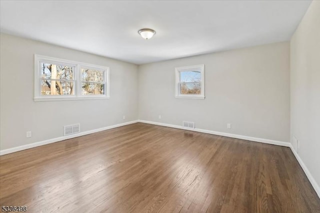 empty room featuring dark wood-type flooring