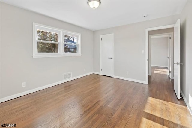 unfurnished bedroom featuring wood-type flooring