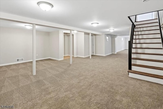 basement featuring light colored carpet