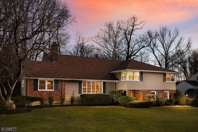 view of front of home featuring a yard