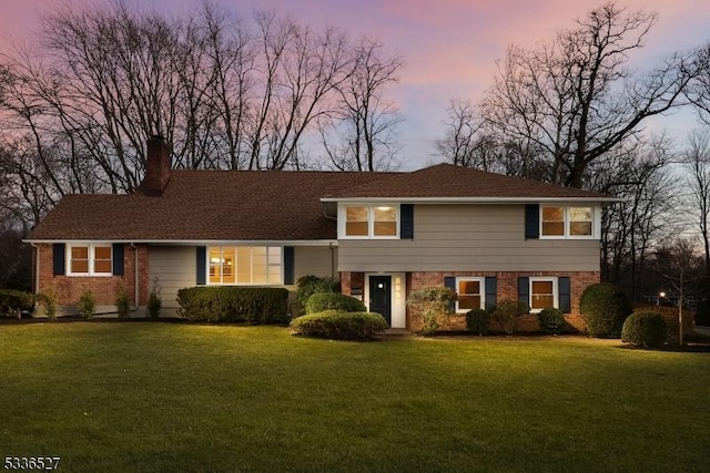 view of front of property with a lawn