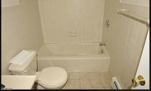 bathroom featuring shower / washtub combination, a baseboard radiator, tile walls, toilet, and tile patterned floors