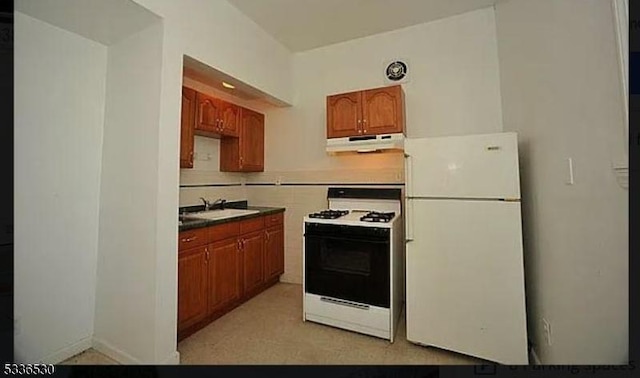 kitchen with sink and white appliances