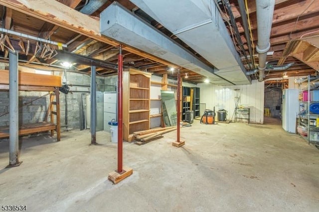 basement featuring white fridge