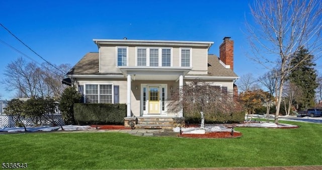 view of property with a front lawn