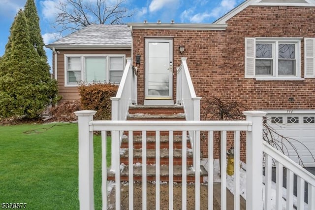 view of front of home featuring a garage and a front lawn