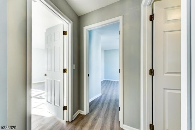 hallway with light hardwood / wood-style flooring