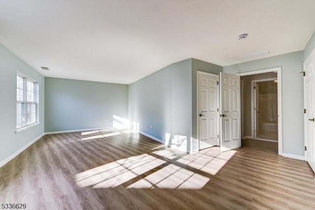 spare room with light wood-type flooring