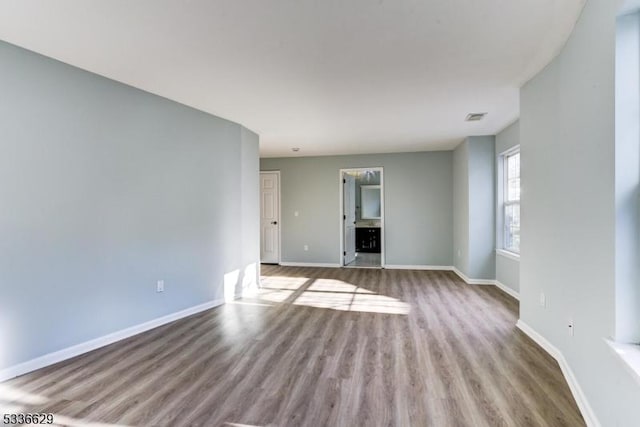 unfurnished living room with light hardwood / wood-style flooring