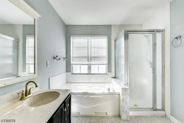 bathroom featuring vanity and separate shower and tub