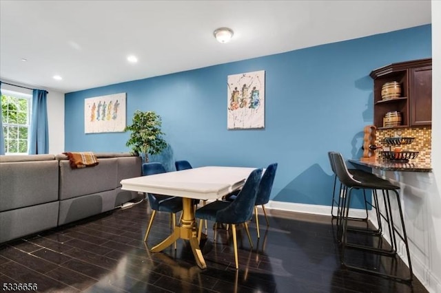 dining room featuring dark hardwood / wood-style flooring