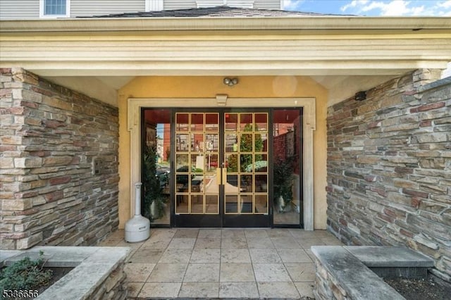 entrance to property featuring french doors