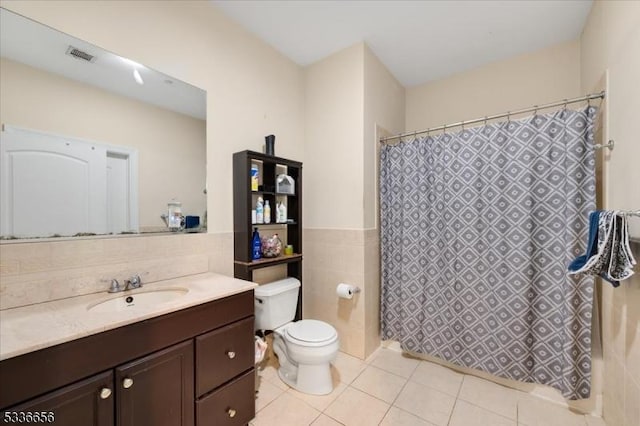 bathroom with tile walls, tile patterned flooring, vanity, a shower with curtain, and toilet