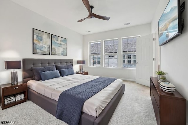 carpeted bedroom with ceiling fan