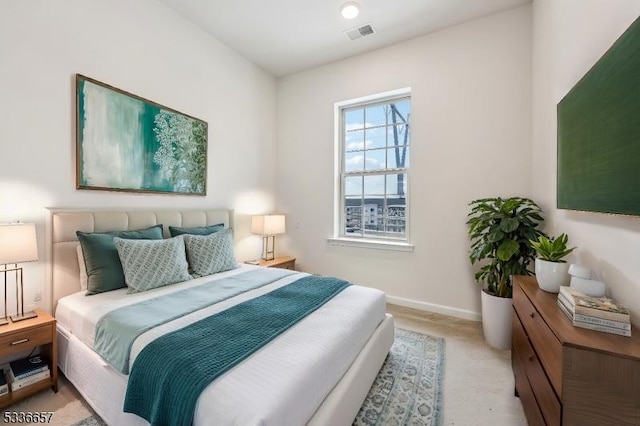 bedroom with light colored carpet