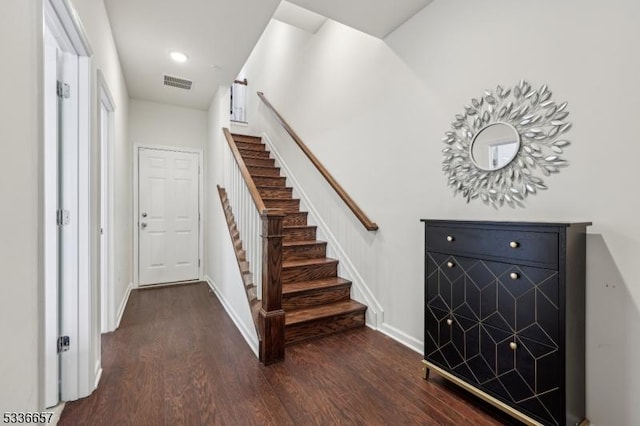 staircase with hardwood / wood-style flooring