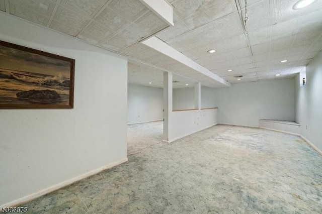 basement featuring carpet flooring