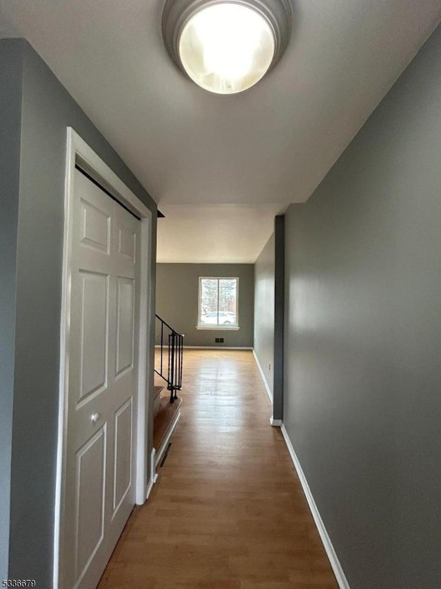 hallway featuring hardwood / wood-style flooring