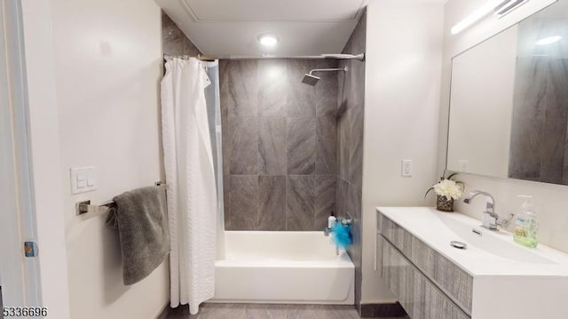 bathroom with vanity and shower / bath combo