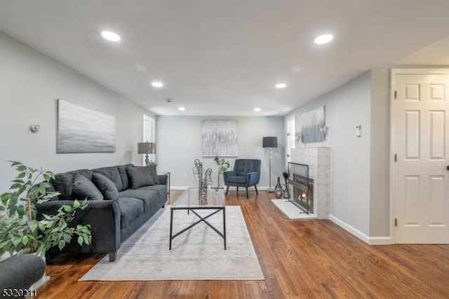 living room featuring dark hardwood / wood-style floors and a fireplace