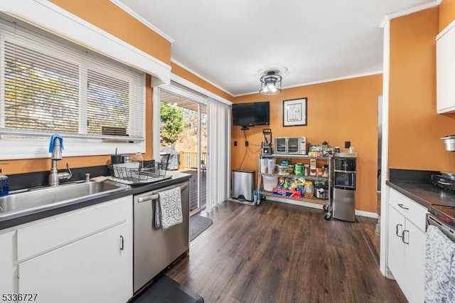 kitchen with crown molding, appliances with stainless steel finishes, sink, and white cabinets