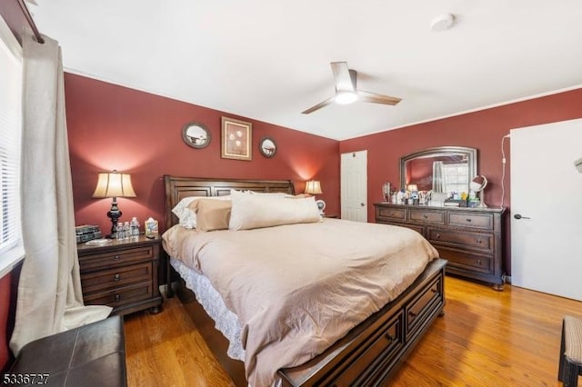 bedroom featuring hardwood / wood-style flooring and ceiling fan