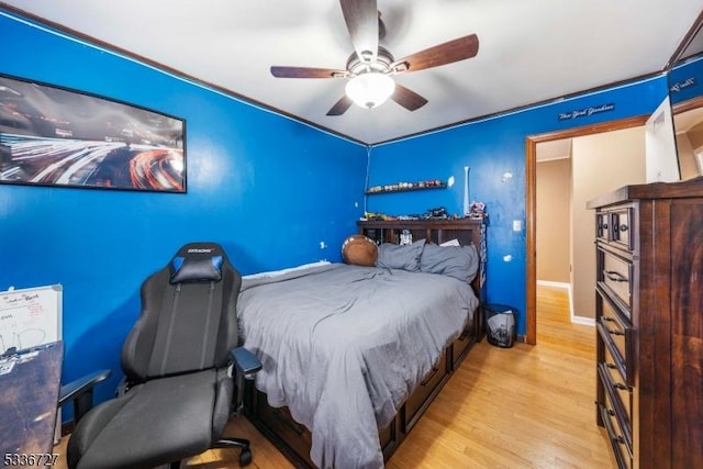 bedroom featuring ceiling fan and light hardwood / wood-style floors