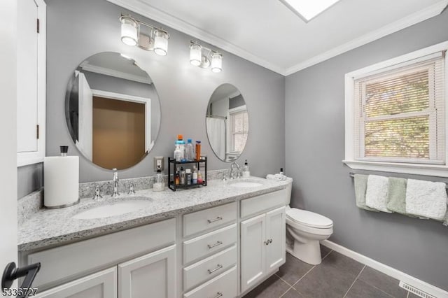 bathroom with crown molding, tile patterned floors, toilet, and vanity