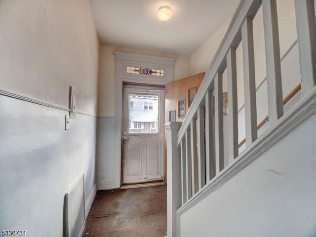 entrance foyer featuring concrete flooring