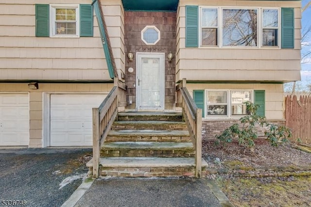 view of exterior entry featuring a garage